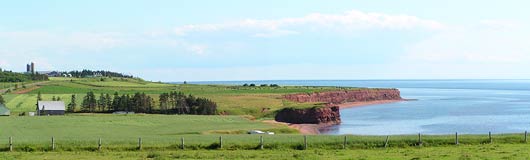 Green fields, red bluffs, blue sea and sky -- the primary colors of P.E.I.